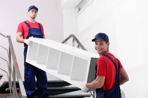 House removals team loading boxes in Kensington street
