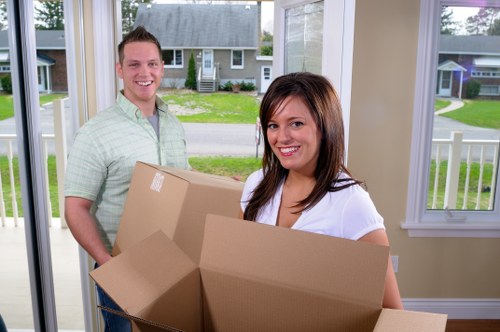 Professional packing team preparing boxes in Kensington home