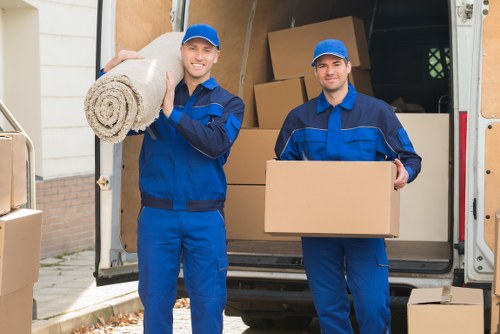Professional movers handling boxes for removals Kensington