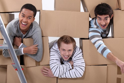 Moving and storage services in Kensington with packed boxes and furniture