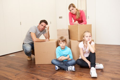 Careful wrapping of fragile household items for a Kensington move